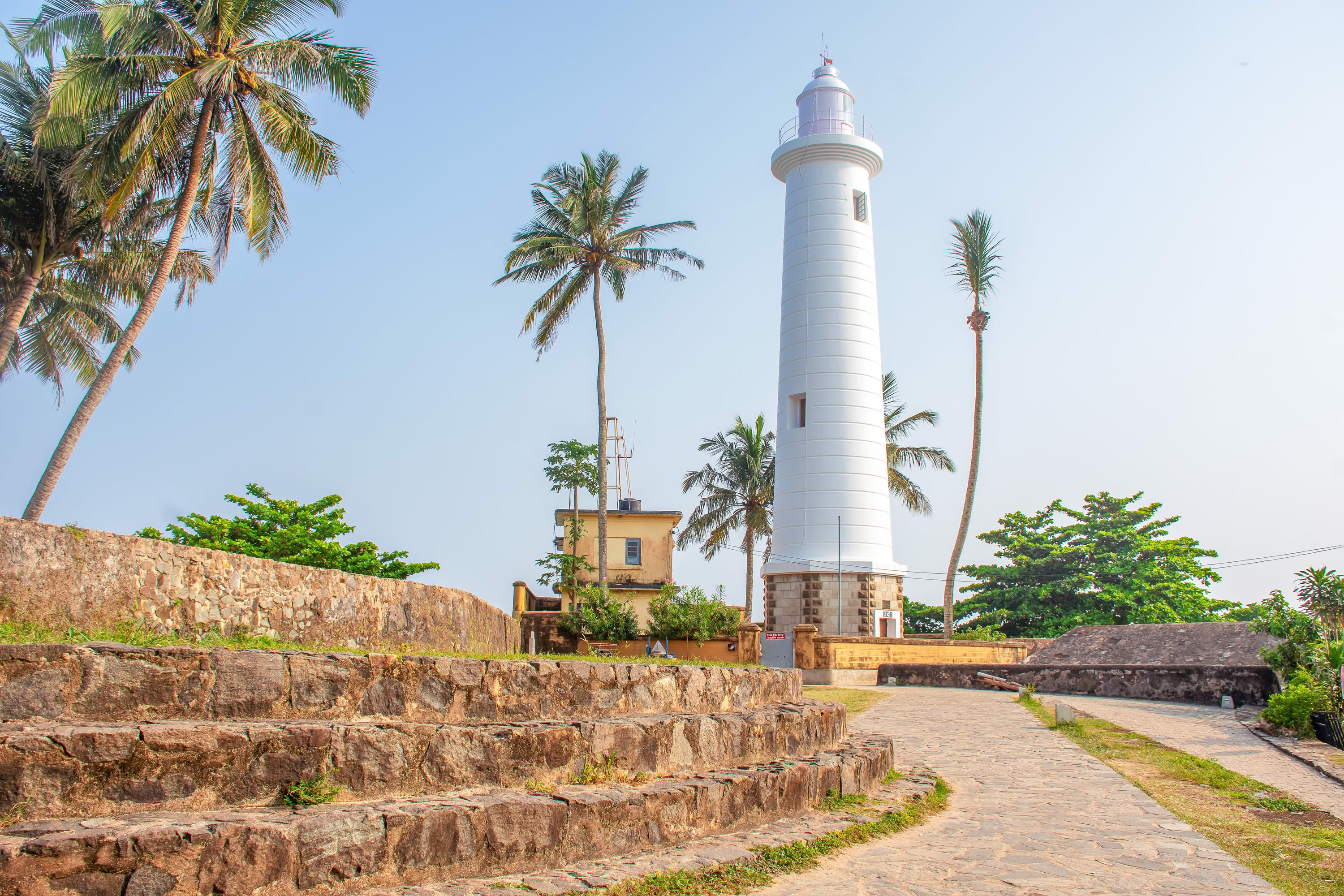 Galle Fort lighthouse with coconut palms