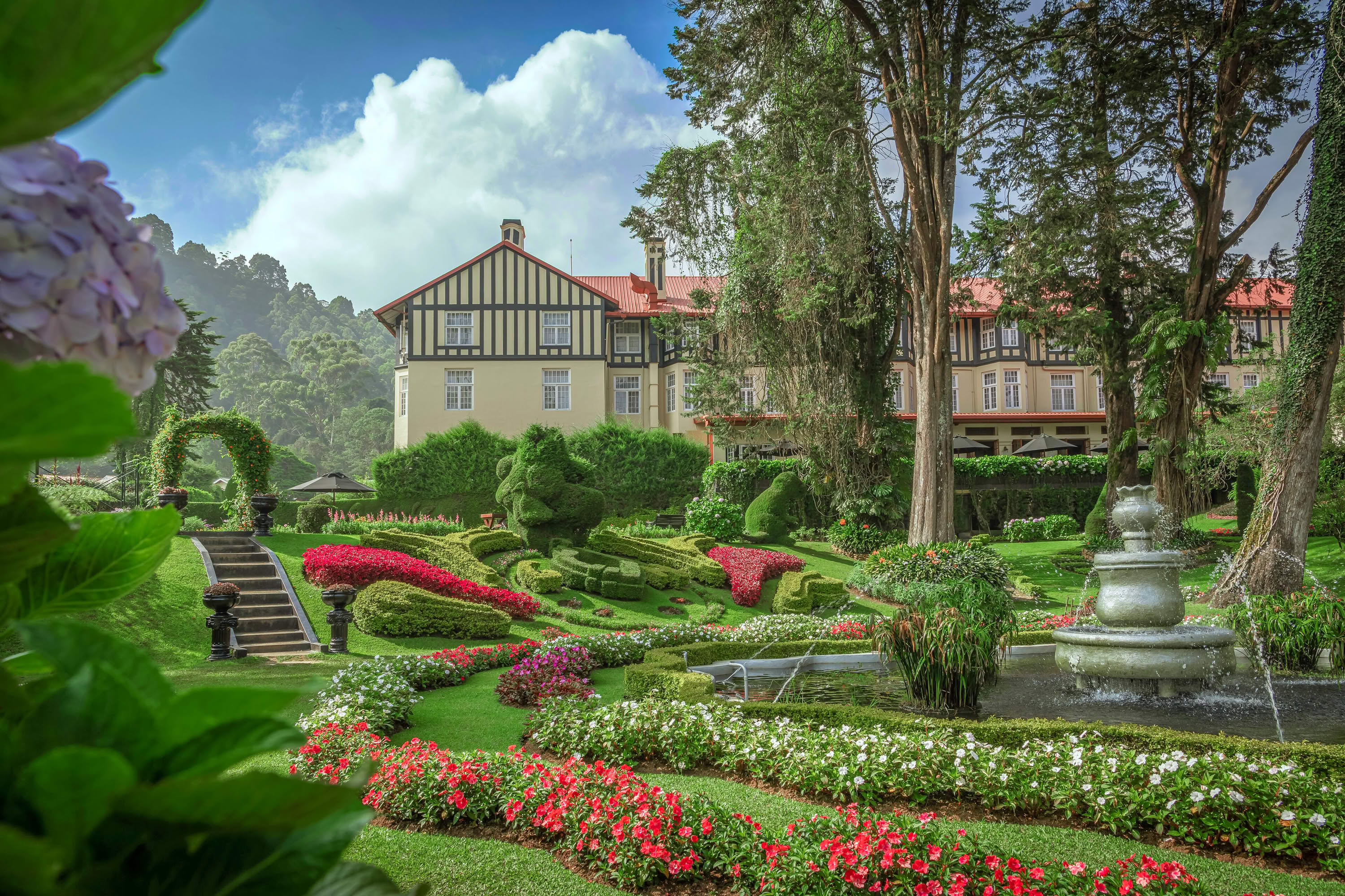 The Grand Hotel Nuwara Eliya Tudor facade with formal gardens