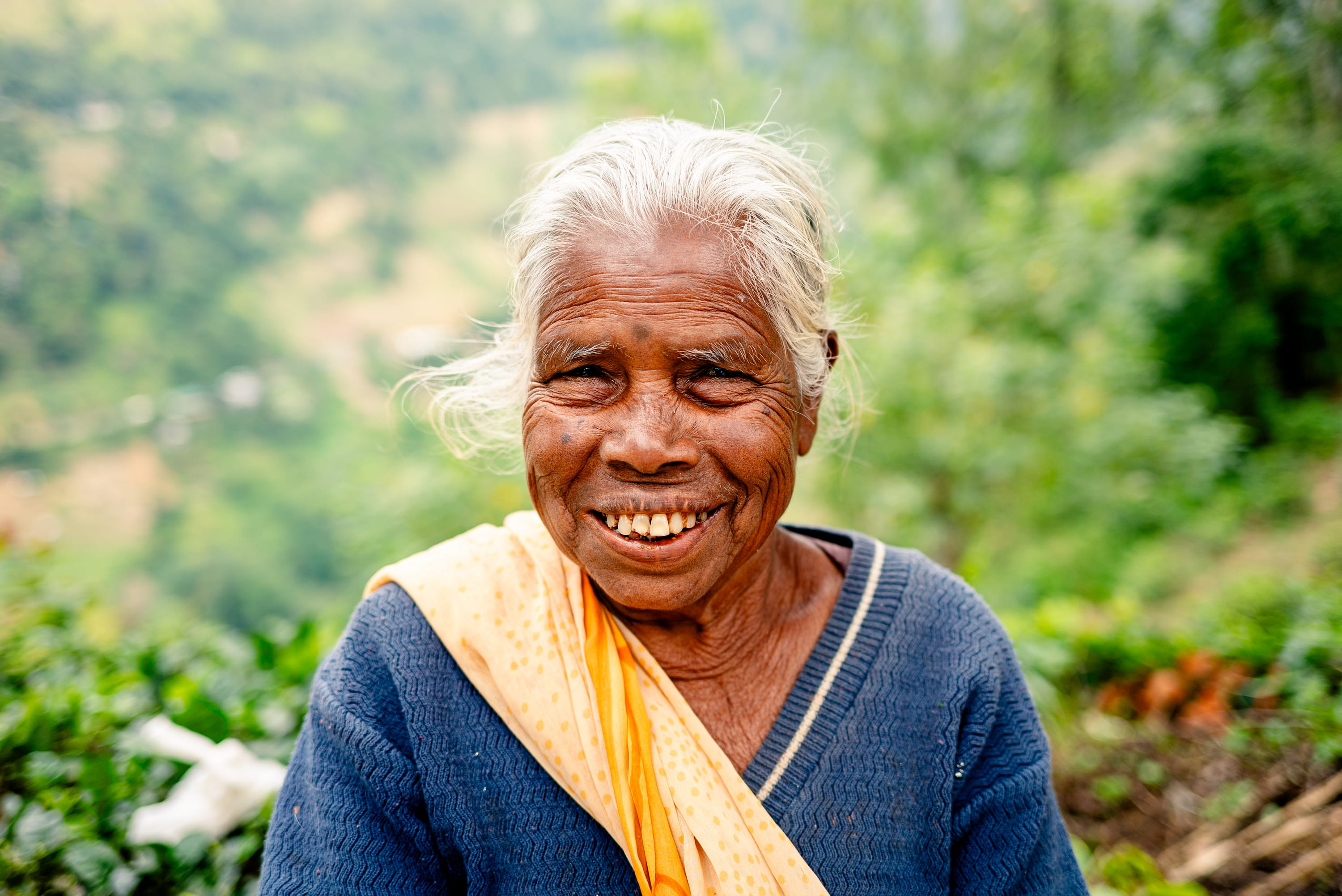 Smiling tea plantation worker in the Sri Lanka highlands